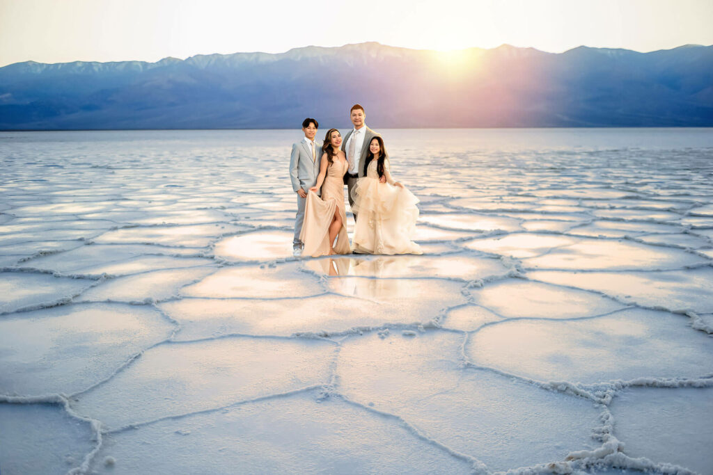 Family in formal dress posing at Badwater Basin Death Valley