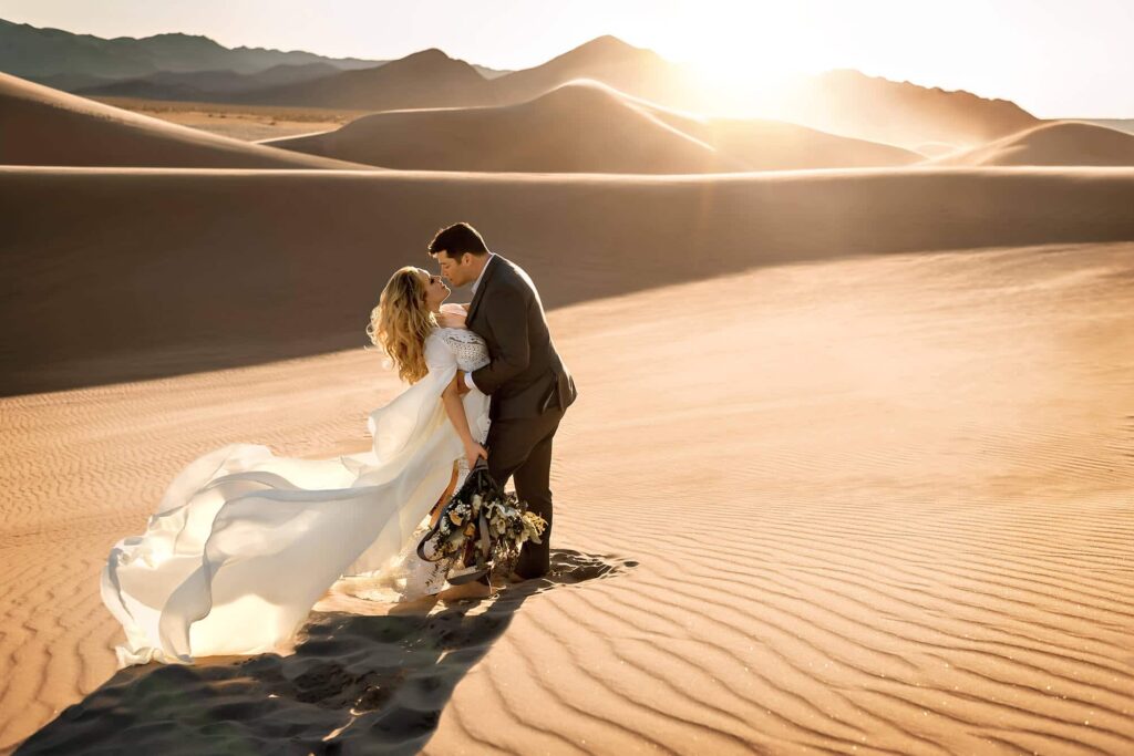Sand dune couple engagement portrait by Eden Bao