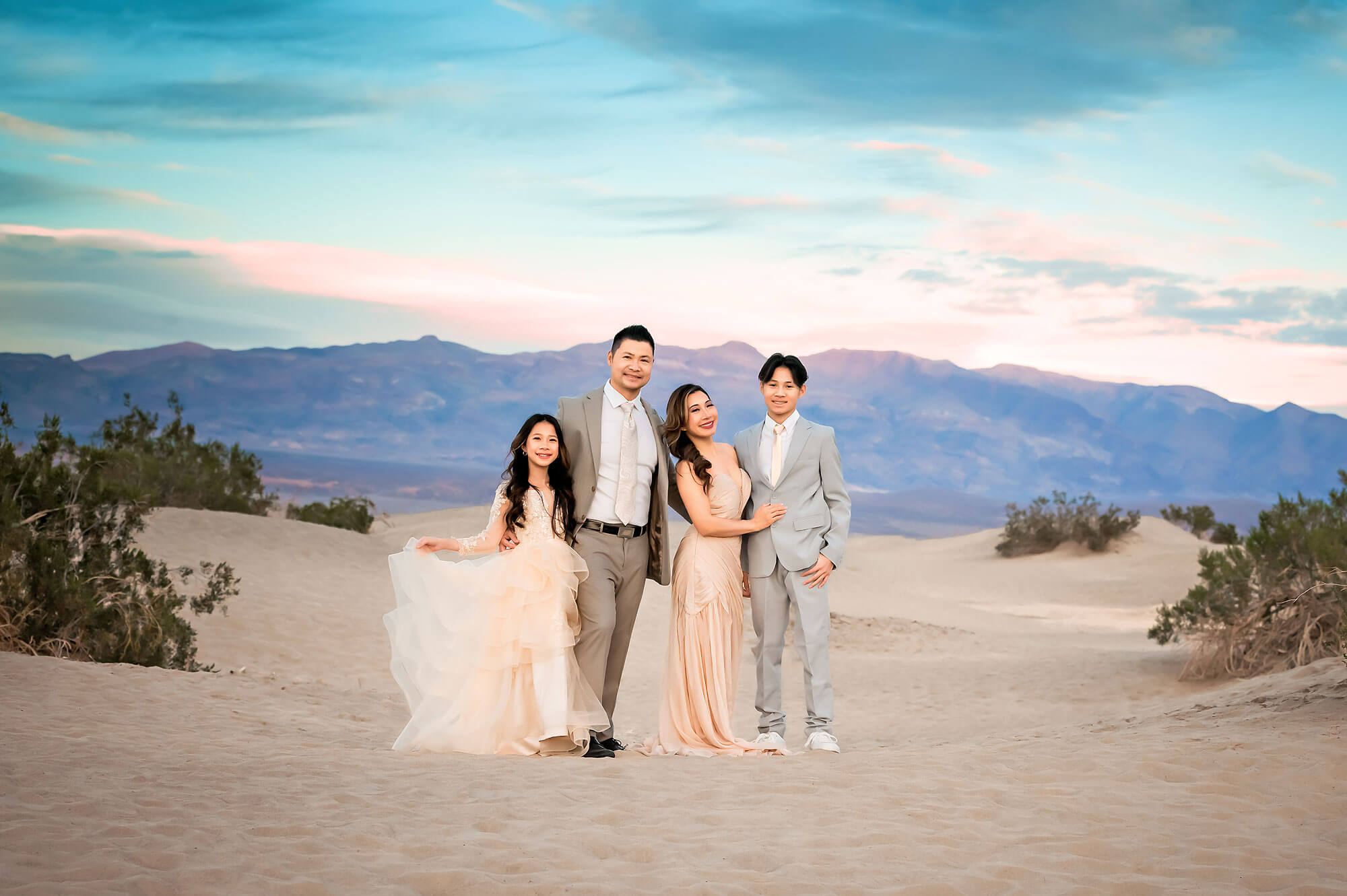 Family posing at Mesquite Flat Sand Dune Death Valley for Family Photographer